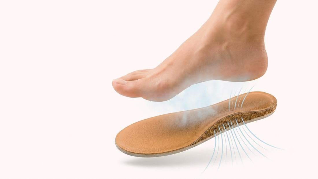 Close-up of a SPA GAIT leather insole showing a premium leather top and breathable coconut fibre layer with airflow passing through the structure.