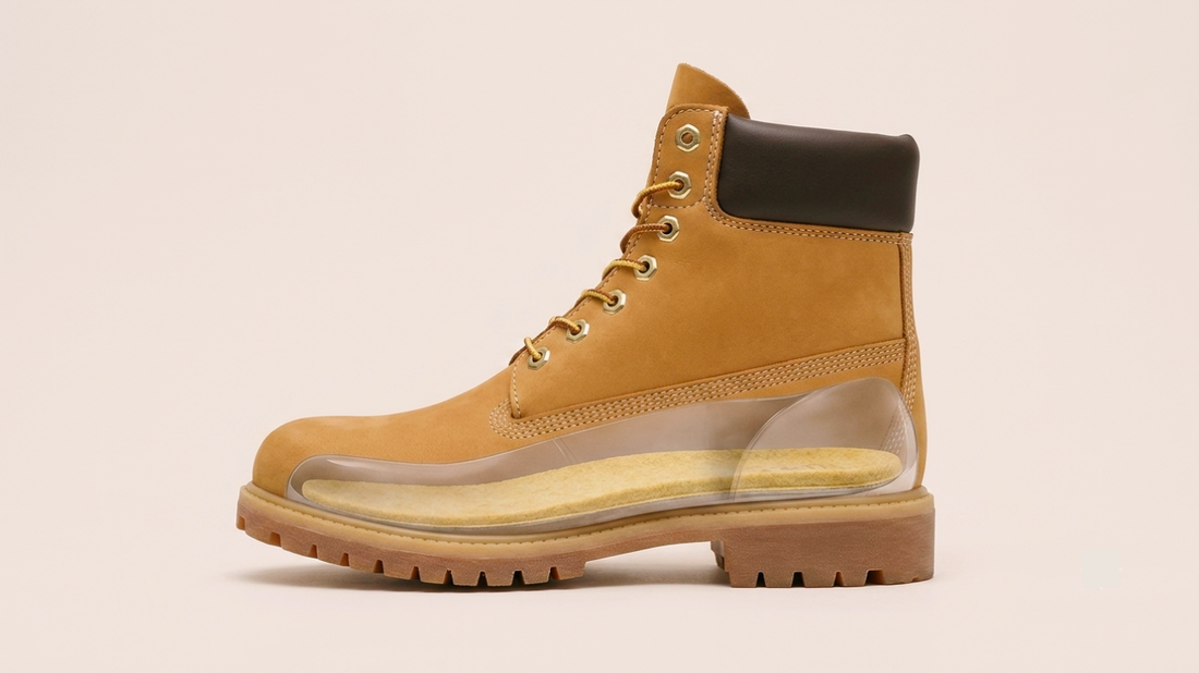 SPA GAIT leather insole inside a yellow leather boot. Demonstrates perfect fit and compatibility with sturdy boots, showing how adaptive leather insoles provide comfort and support in everyday footwear.