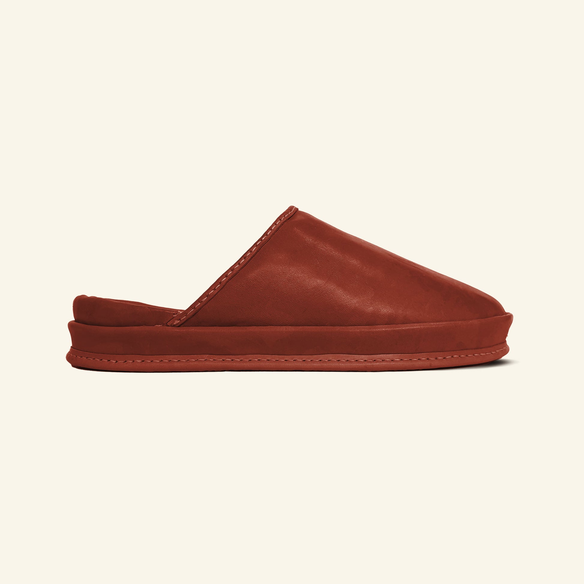 Terracotta Ember eco-friendly leather clogs on white background.
Soft Terracotta Ember leather slippers women’s design. 
