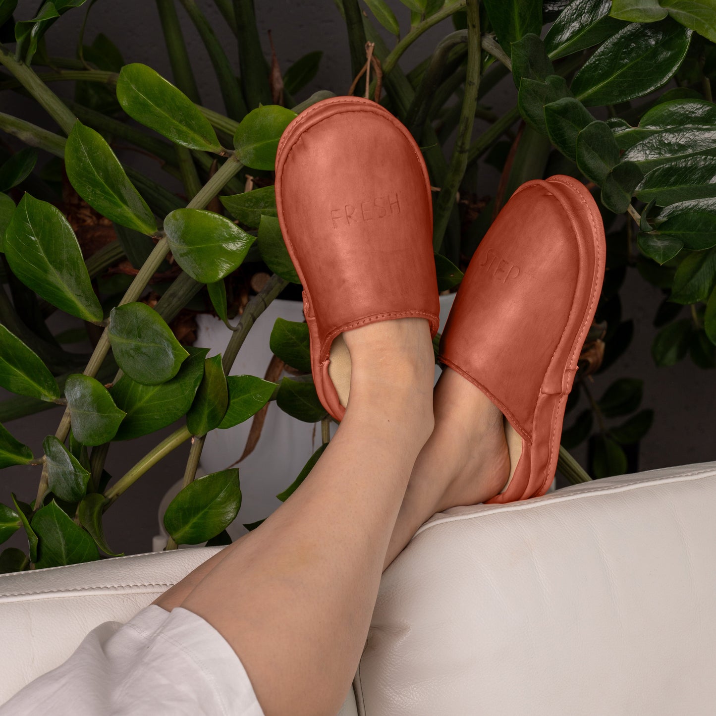 Soft Terracotta Ember leather clogs casual sofa comfort. Anatomical Terracotta Ember leather clogs everyday relaxation. Eco-friendly Deep Baltic slip-on leather clogs lifestyle shot. 
